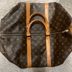 Loui Vuitton duffle bag , like brand new . only worn a few times!